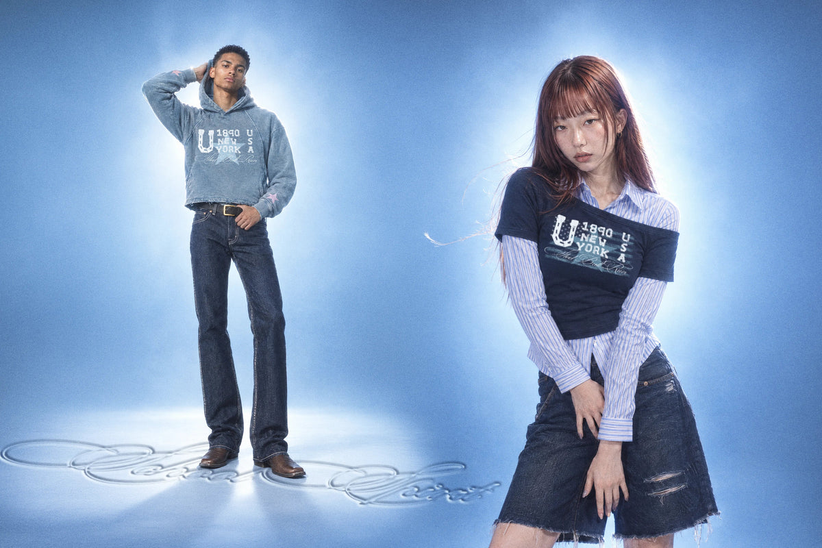 Model wearing an oversized printed anime hoodie styled with layered streetwear pieces