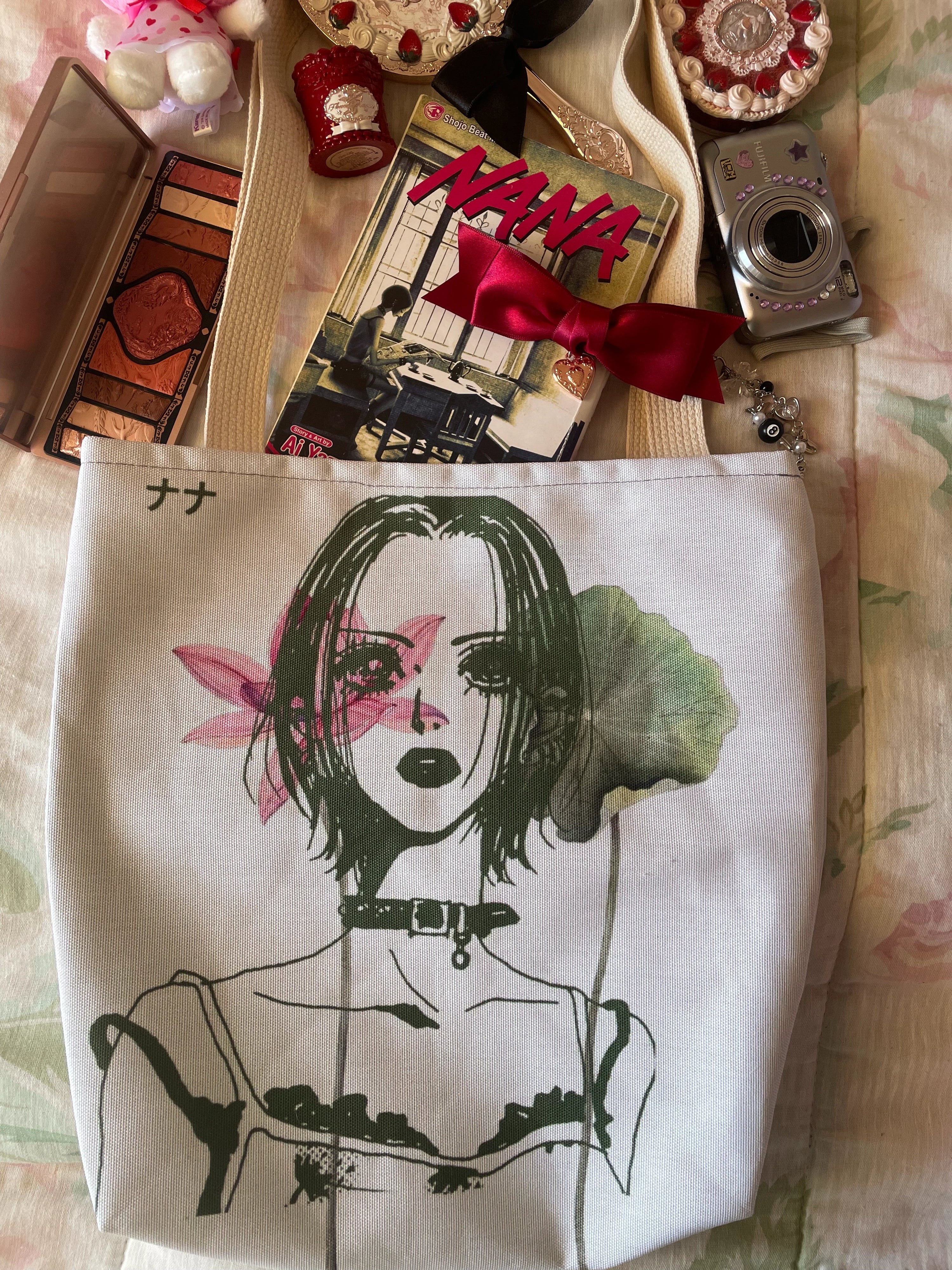 Close-up detail of white canvas tote bag with vintage anime girl illustration, Y2K aesthetic