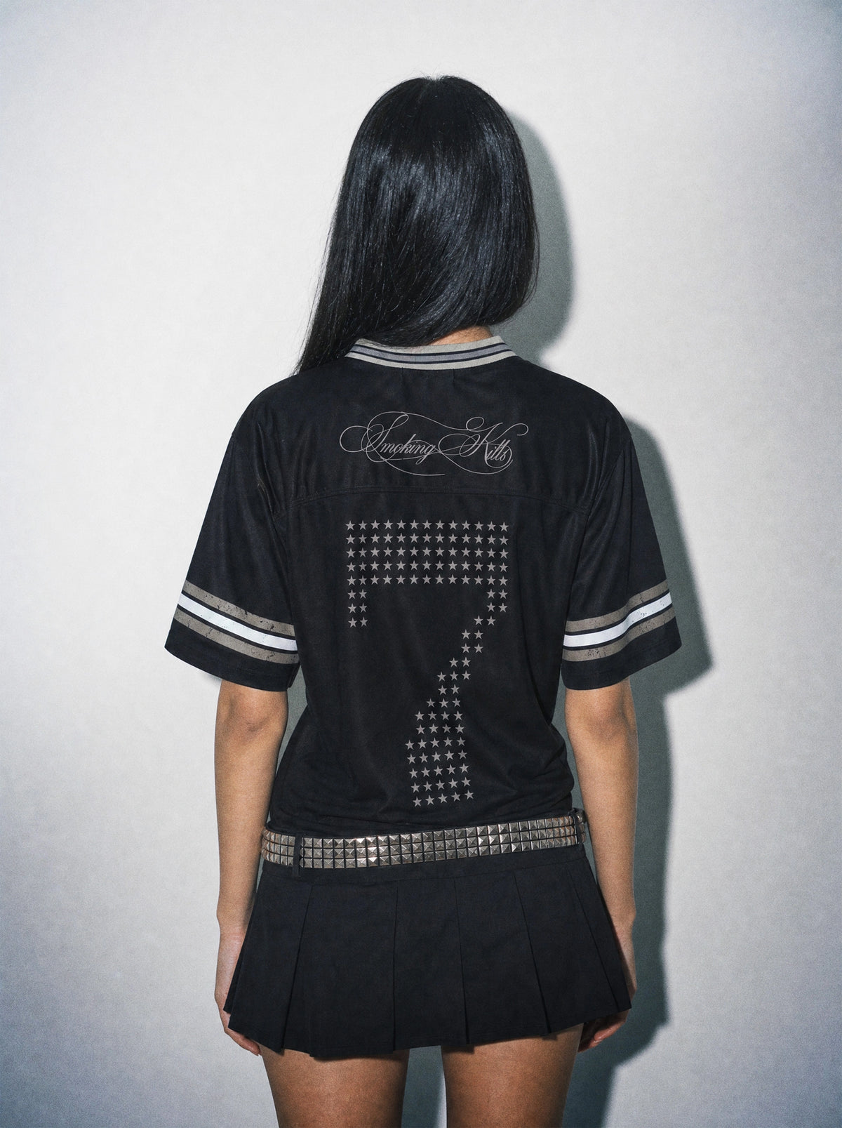 Back view of black oversized jersey with smoking-klls back print, anime-inspired streetwear